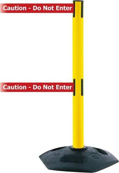 Tensator - 38" High, 2-1/2" Pole Diam, 4 Way Stanchion - 19" Base Diam, Octagon Recycled Rubber Base, Yellow Plastic Post, 7-1/2' x 2" Tape, Dual Line Tape, For Outdoor Use - Caliber Tooling