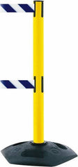 Tensator - 38" High, 2-1/2" Pole Diam, 4 Way Stanchion - 19" Base Diam, Octagon Recycled Rubber Base, Yellow Plastic Post, 7-1/2' x 2" Tape, Dual Line Tape, For Outdoor Use - Caliber Tooling