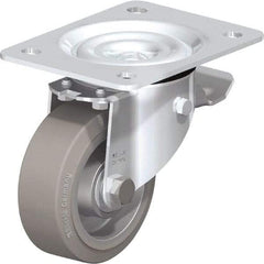 Blickle - 4" Diam x 1-37/64" Wide x 5-7/64" OAH Top Plate Mount Swivel Caster with Brake - Solid Rubber, 440 Lb Capacity, Ball Bearing, 5-1/2 x 4-3/8" Plate - Caliber Tooling